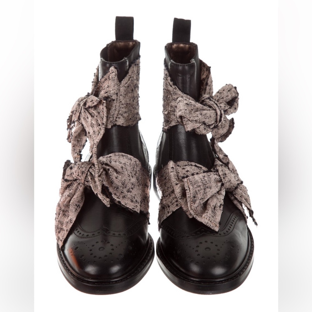 Black Leather ankle boots with brogue trim, bow accents. Box & dust bag included
